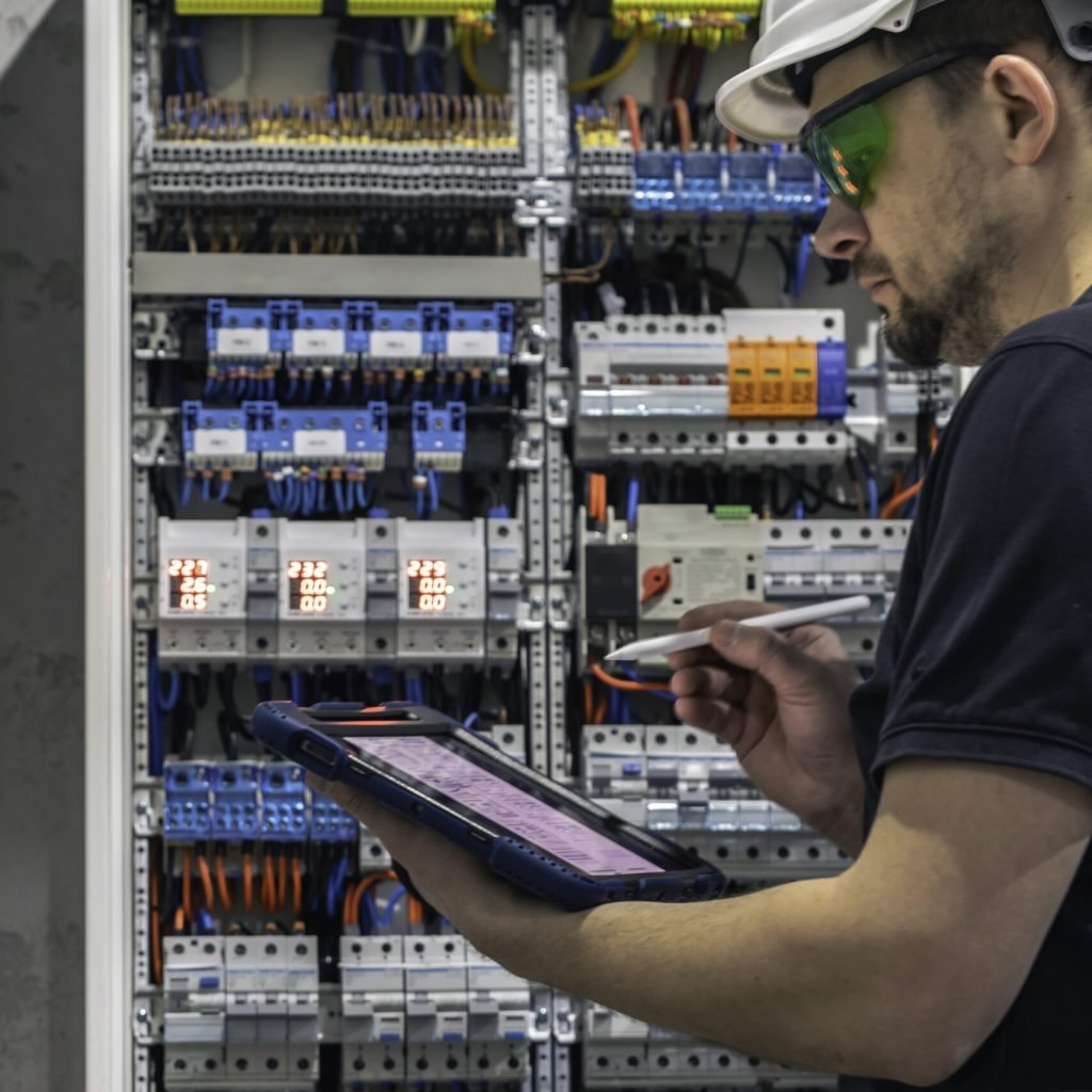 man-electrical-working-switchboard-with-fuses-uses-tablet Man, an electrical technician working in a switchboard with fuses. Installation and connection of electrical equipment. Professional uses a tablet. SSUCv3H4sIAAAAAAAACpySz27CMAzG75P2DlXOVIImsHavgnZwE0MjQoKSlGlCvPvyp0Xedbf6Z/uzv7iP97emYSMELdln88hRirUxc4geonY24e1m4R6tQk/J3fPDlgLQNEKlo/MaDIUjRDlZuGKCdjYm42dJshAhzgFD3mVBEiKek0aFL4m68LHGzZooydSRUoxtCAvzWNiKqvi/OuvH18vwGa38KQsTIx4NQjVyrKXs8h3RX6k1mJV2xNXdSTC5gBMl0Dfw8Kfv5rXU9kyIi1O5y6ok3Wyjz1u9zDDj3A1Gk1/9lMbgyicIIZWrlZPZMv0F7krmWBeLp0WVqXScHO4434u+E53gYtiKYeiXgnrQSSedss4qlGJ50Yq60nkDhl2nPj5OfbsTsGsFP2AL3dC3eyE4Iu4R4JRu8fwFAAD//wMAixNDl7kCAAA=